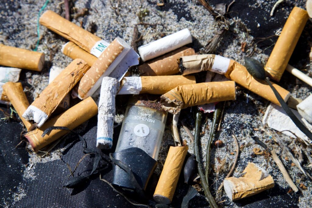Pile of cigarette butts on the beach
